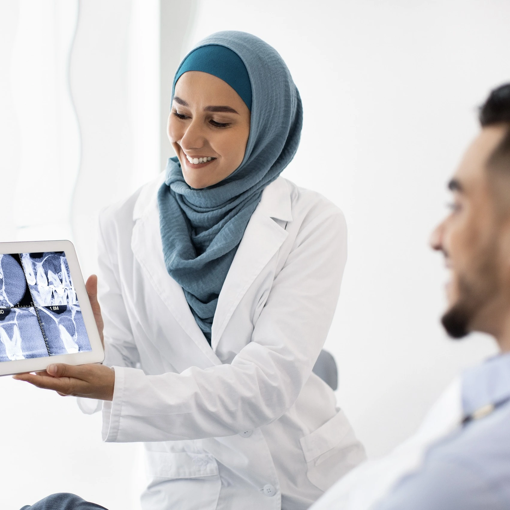An image of a doctor and a patient talking